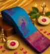 Elegant Teal & Magenta Silk Saree with Peacock Motif and Zari Border