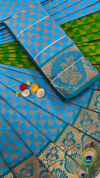IMG_20251216_113440 (1) (1) Sky Blue & Green Peacock Zari Silk Saree