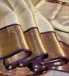IMG-20261017-WA0091 Trending Cream & Royal Purple Border Banaras Soft Tissue Saree with Rich zari Woven Pallu
